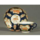 A Worcester Scale Blue porcelain tea cup and saucer, decorated in the Japanese Kakiemon style.