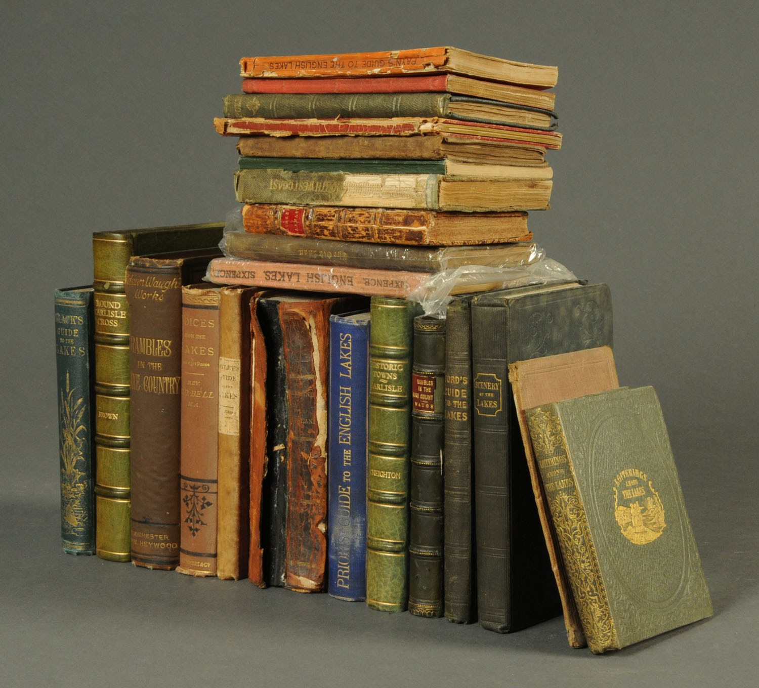 A collection of local antiquarian books, "Round Carlisle Cross" by Brown, "Historic Towns,
