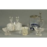 A German glass stein, with pewter lid, a cut glass condiment set, three salts,