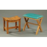 Two oak stools, one with saddle shaped top the other upholstered in green leatherette material.