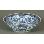 A 19th century Chinese blue and white bowl, foliate decoration. Diameter 38.