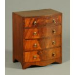 An early 19th century mahogany miniature bowfronted chest of drawers,