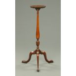 An Edwardian mahogany plant stand, with piecrust moulded edge,