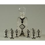 An Edwardian style black glass overlay decanter, with six matching tumblers.