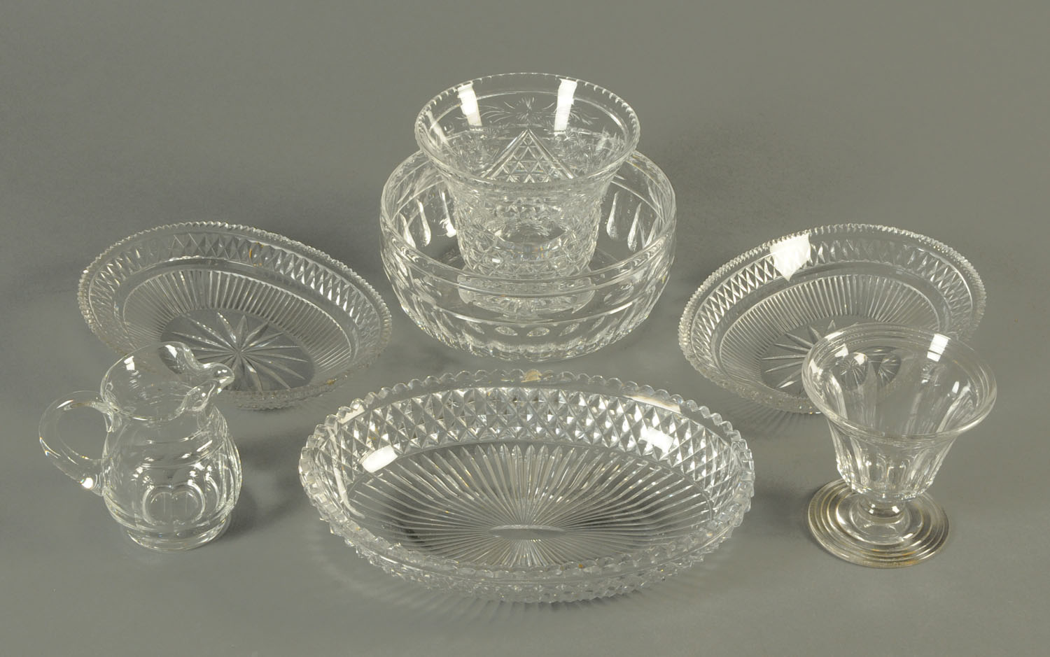 Seven pieces of 19th century cut glass, comprising fruit bowl, two trumpet shaped vases,