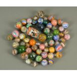 A collection of 62 Victorian and later marbles, .5" to 1.5", including Micas, onion skins, etc.