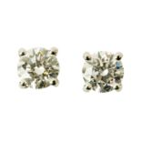 A pair of 18 ct white gold screw back diamond stud earrings, diamond weight +/- .