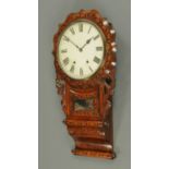 A Victorian inlaid walnut American wall clock, with shaped dial surround and bolster scroll foot.