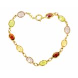 An 18 ct yellow gold multi-stone bracelet, rubover set with faceted oval stones, three amethyst,