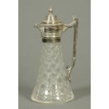 A Victorian cut glass claret jug, with metal handle. Height 29 cm.