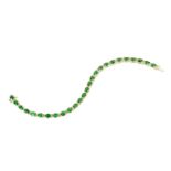 A 14 ct gold oval emerald and diamond bracelet, emerald weight +/- 8.43 carats, diamond weight +/- .