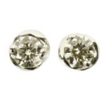 A pair of 18 ct white gold stud earrings, twist design, set with diamonds weighing +/- .80 carats.