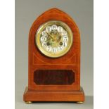 An Edwardian inlaid mahogany mantle clock, the dial signed "Marc, Paris". Height 28 cm.