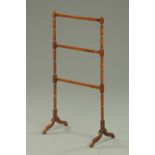 A 19th century George III style mahogany clothes or towel stand.