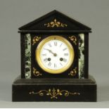 A late Victorian black slate and marble mantle clock, with two-train striking movement.