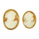 Two gold coloured metal cameo brooches.