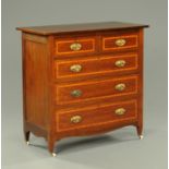 An Edwardian inlaid mahogany chest of drawers,