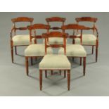 A set of six Regency mahogany dining chairs, two arm and four single,