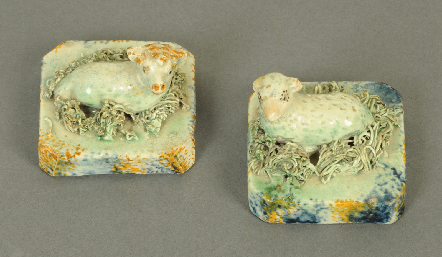 A pair of early 19th century Pearlware recumbent lambs, each bearing "Jonathan Horne" label to base.