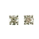 A pair of 18 ct white gold round brilliant cut stud diamond earrings, diamond weight +/- .64 carats.