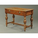 An early 20th century carved oak side table,