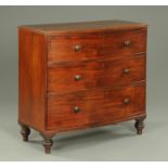 An early 19th century mahogany bowfronted chest of three drawers,