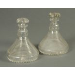 A pair of small cut glass ships type decanters, each with mushroom stopper. Height 20 cm.