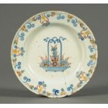 Three 18th century Delft tin glazed plates, polychrome and two underglaze blue.