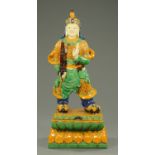 A large Chinese Warrior, raised on a plinth. Height 140 cm.