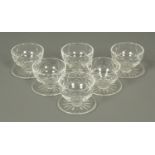 A set of six Waterford Crystal grapefruit bowls, with integral stands, each etched "Waterford".