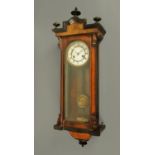 A Victorian walnut and ebonised Vienna regulator wall clock, with two-train spring driven movement.