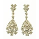 A pair of 18 ct white gold dropper earrings, pear shape cluster, set with diamonds weighing +/- 2.