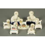 A collection of seven Victorian Staffordshire poodles. Tallest 12 cm.