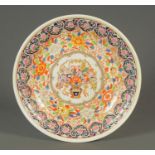 A 19th century Chinese charger, painted in enamel colours. Diameter 47 cm.