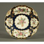 A Worcester Scale Blue porcelain lobed dish, decorated with flowers. Diameter 25 cm.