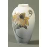 A Royal Copenhagen vase, decorated with a single flower, printed marks to base. Height 18 cm.