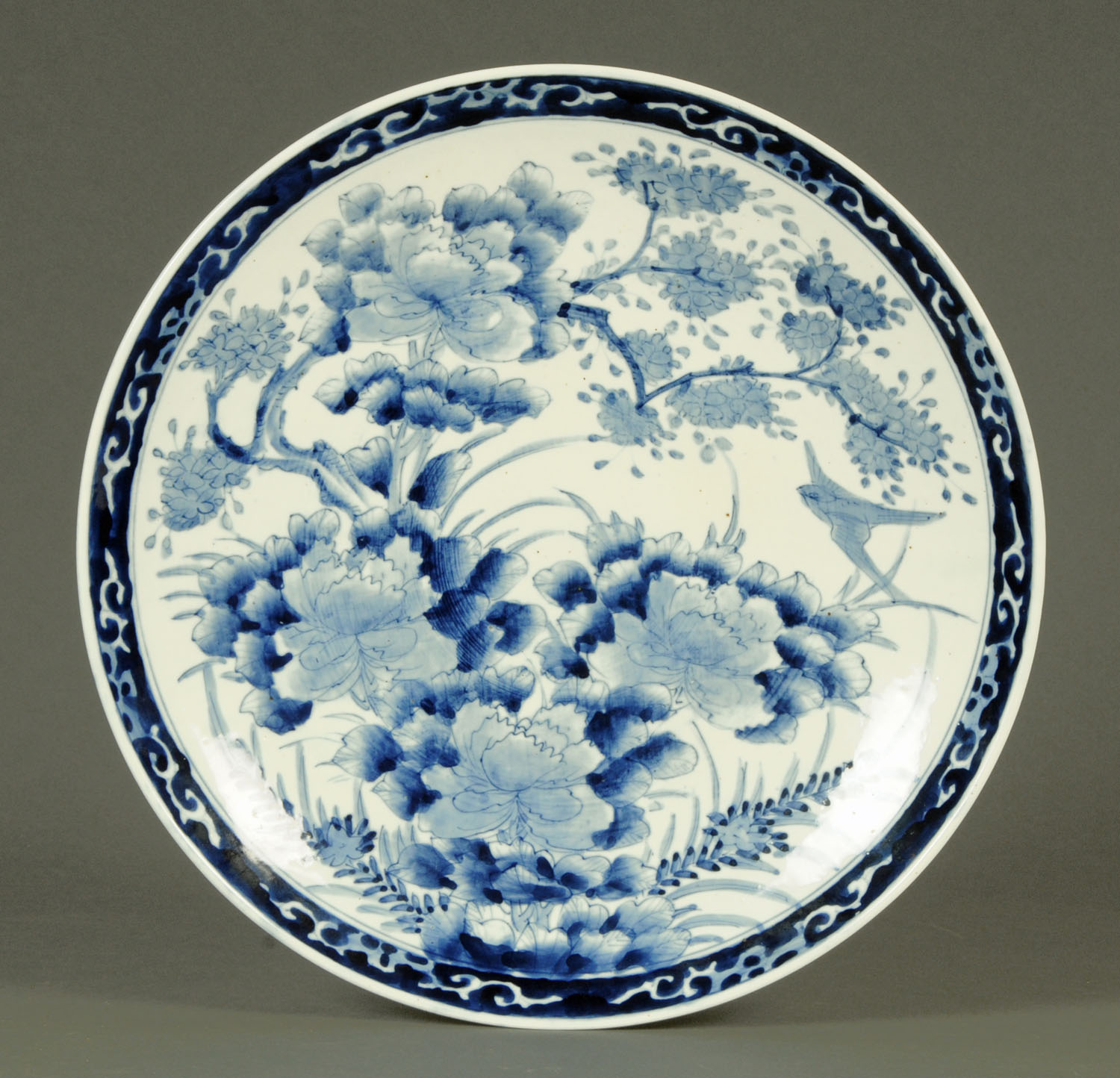 A 19th century Japanese Arita charger, blue and white. Diameter 41 cm.
