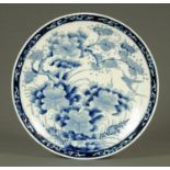 A 19th century Japanese Arita charger, blue and white. Diameter 41 cm.