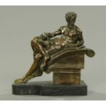 A late 19th century bronze figure of a reclining classical male nude. Height 22.5 cm.