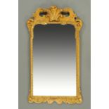 A gilt framed mirror, mid 20th century, in the Regency style with Prince of Wales plume.