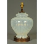 A Vaseline glass table lamp base. Height excluding bulb fitting 33 cm.