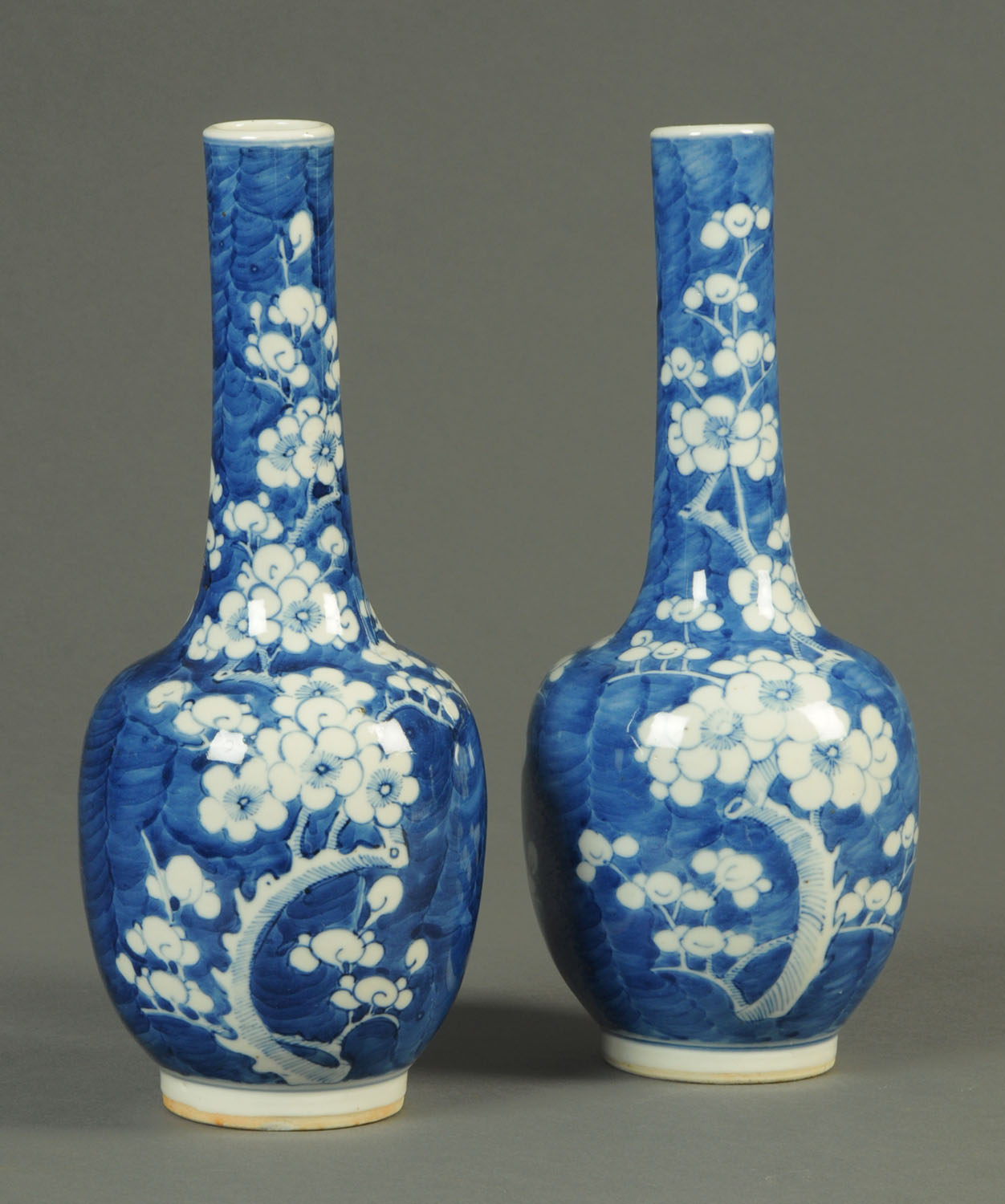 A pair of 19th century Chinese prunus vases, club shaped and with four character mark to base.