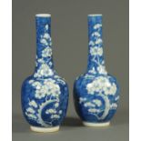 A pair of 19th century Chinese prunus vases, club shaped and with four character mark to base.