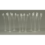 A set of eleven crystal champagne flutes. Height 24.5 cm.