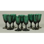 A set of nine 19th century green glass drinking vessels, with ground pontil marks. Height 13 cm.