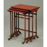 A nest of three Edwardian tables, with ring turned legs. Width 53 cm.