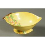 A Carltonware leaf moulded bowl, yellow ground with dog roses. Length 28 cm.