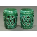 A pair of 19th century Chinese turquoise glazed pierced barrel form garden seats.