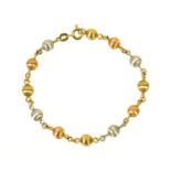 A 9 ct white yellow and rose gold bracelet, 6.9 grams. Length 19 cm.