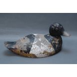 Late 19th/early 20th century carved wooden duck decoy, glass eyes. Length 33 cm.